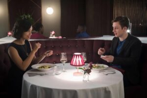 Two "Black Mirror" characters on a dinner date